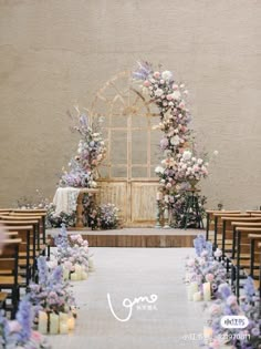 an outdoor ceremony setup with flowers and candles