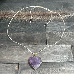 Beautiful Purple Amethyst Heart Pendant Necklace. This Beautiful Wire Wrapped Heart Necklace Is Handmade Using Gold Wire, 0.8 Mm Waxed Polyester Cord Waterproof! Amethyst Round Beads Finished With A Sliding Macram Knot. This Necklace Makes A Great Gift!! Length Is 24” Bohemian Purple Necklace With Heart Beads, Purple Double Heart Jewelry With Heart Charm, Purple Double Heart Charm Jewelry, Purple Amethyst Heart Necklaces, Purple Heart-shaped Amethyst Necklaces, Purple Amethyst Heart Necklace, Purple Heart Amethyst Necklace, Adjustable Purple Jewelry With Heart Charm, Adjustable Purple Necklaces With Heart Beads