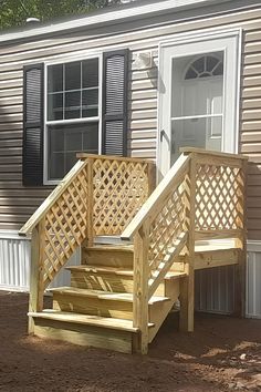 a wooden staircase leading up to a house