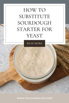 a glass jar filled with liquid sitting on top of a wooden spoon next to a brush