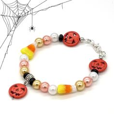 a bracelet with halloween decorations on it