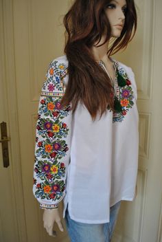 Flower women's embroidered blouse Ukrainian embroidery Blouse for spring Ethnic blouse Flower Vyshyvanka shirt Made of cotton fabric white color, this fashionable machine embroidered blouse is very easy to match with skirts or pants, including jeans. Production: I sew all blouses by your own measurments. All embroideries are made to order: it will take up to 20-30 working days from the date of payment. In case you wish other colors or if your order is urgent - please contact us before you buy! S Ukrainian Blouse, Ukrainian Embroidery, Womens Blouses, Needle Work, Embroidery Blouse, Flower Shirt, Embroidered Blouse, Ukraine, Blouses For Women