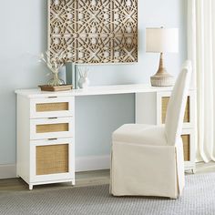 a white desk and chair in a room