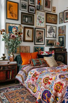 a bedroom with lots of pictures on the wall