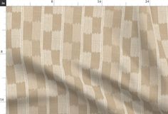 a beige and white striped fabric with vertical lines on the bottom, as well as an area for text