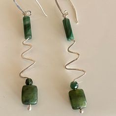 These sweet earrings are made with hand-hammered sterling wire to capture the jade stones. They are topped with small jade tubes. They hang approximately 2 inches long, from hammered sterling ear wires. Wire Jewelry Making, Sweet Earrings, Wrapped Earrings, Wire Wrapped Earrings, Jade Stone, Ear Wires, Wire Jewelry, Wire Wrapped, Jewelry Earrings Dangle