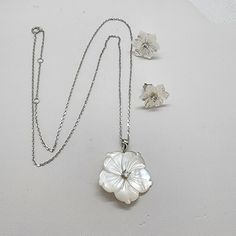 Indulge In The Timeless Elegance Of Our Brand New Sterling Silver 925 Pearl White Flower Earrings Necklace Set. This Beautifully Crafted Set Features A Delicate Pair Of Earrings With A Stunning Gemstone In The Center, Complemented By An 18" Necklace With A 2" Extension For The Perfect Fit. Each Set Also Comes With A Free Jewelry Bag For Safekeeping. Elevate Your Style With This Exquisite Set. White Mother Of Pearl Jewelry In Flower Shape, White Mother Of Pearl Flower Shaped Jewelry, Elegant Mother Of Pearl Flower Jewelry, Elegant Flower Shaped Mother Of Pearl Jewelry, Elegant Flower-shaped Mother Of Pearl Jewelry, Flower Shaped Mother Of Pearl Jewelry For Anniversary, Mother Of Pearl Flower Jewelry For Anniversary, White Flower Shape Jewelry For Anniversary, Anniversary Jewelry Mother Of Pearl Flower Shape