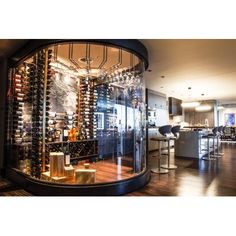 a wine cellar in the middle of a living room