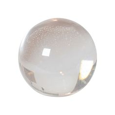 a glass ball with white speckles on it