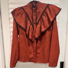 Rust Gingham Patterned Ruffle Button Down Blouse Top With Nice Black Lace Trim Details And High Collar. Nwt. Fall Gingham Button-up Blouse, Chic Plaid Blouse For Daywear, Plaid Long Sleeve Blouse With Ruffles, Plaid Ruffled Blouse For Work, Plaid Ruffle Blouse For Work, Fall Plaid Top With Ruffles, Fall Plaid Ruffled Tops, Plaid Blouse With Button Closure For Daywear, Gingham Button-up Blouse For Work