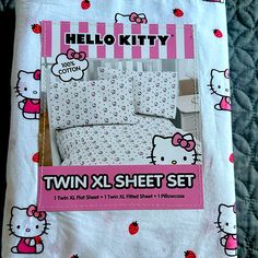 the hello kitty twin sheet set is pink and white