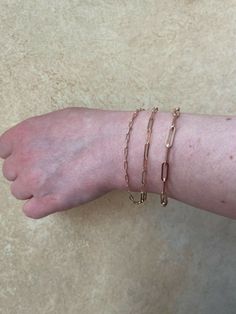 "Super trendy and stylish handmade sterling silver paperclip bracelets 2.5mm, 3mm & 4mm Solid 925 sterling silver with rose gold finishro Stamped \"925\" & \"Italy\" We have in 6-8\" Here is weights for 7\"...if your bracelet is longer or shorter weight will vary slightly 2.5mm- 2g 3mm- 2.7g 4mm- 4.8g Ships fast We also sell matching chains Let us know if any questions" Gift Rose Gold Oval Link Chain Bracelet, Rose Gold Paperclip Bracelet Gift, Rose Gold Oval Link Paperclip Bracelet, Classic Rose Gold Paperclip Chain Bracelet, Rose Gold Link Paperclip Bracelet With Adjustable Chain, Rose Gold Bracelets With Lobster Clasp For Everyday Wear, Rose Gold Paperclip Chain Bracelet, Minimalist Rose Gold Paperclip Chain Jewelry, Rose Gold Bracelets With Rectangular Links For Everyday