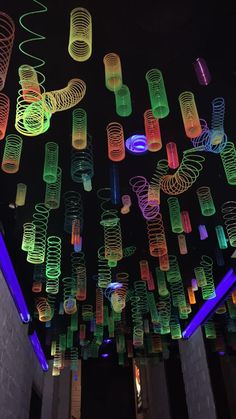 colorful lights hanging from the ceiling in a building