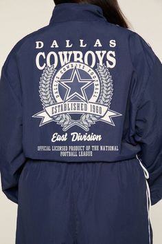 Forever 21+ - A windbreaker jacket featuring a funnel neck, contrasting piped and striped trim, front and back emblem graphics, zip - up from closure, and back "Dallas Cowboys", "East Division", and various text. | Officially licensed product | 100% nylon | Machine wash cold | Model is 5'7" and wearing a Size 1X | Dallas Cowboys Windbreaker Jacket Collegiate Long Sleeve Outerwear With Graphic Print, Throwback Long Sleeve Outerwear With Graphic Print, National Football League, Funnel Neck, Dallas Cowboys, Windbreaker Jacket, Funnel, Division, Dallas