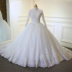 a white wedding dress on display in front of a mirror with the words ariada noyas