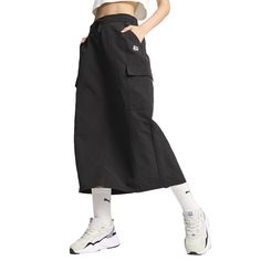 Enjoy the city in style. This versatile midi skirt keeps you comfortable yet chic with multiple pockets to stash your essentials. An elasticated waist and side slits offer a flattering, flexible fit for wherever the day takes you. $54.95 Cargo Midi Skirt, Womens Puma, Black Midi Skirt, Skirt Pattern, In Style, Casual Skirts, The City, Knee Length, Midi Skirt