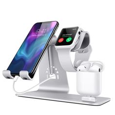 an apple watch and earpods charging station with two iphones in the same holder