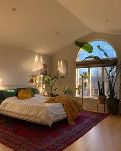 a bedroom with a large bed sitting on top of a rug