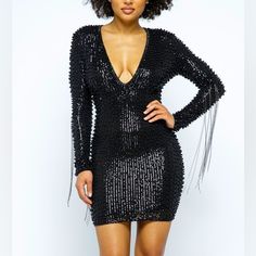 This Best Seller Black Pearl Beaded Dress Is A True Knockout This Deep V-Line Neck Plunges Into A Sea Of Beaded Sequins, Pearls And A Hint Of Metal Fringe. The Metallic Threads Are Black Tones But May Easily Be Paired With Gunmetal Or Antique Jewelry Sequins Dress Small Medium Large Pearl Dress Deep V-Neck Plunging Metal Fringe On Sleeves Mini Dress Stretch Lining Long Sleeves Back Zipper 48%Polyester 40%Pet 12%Spandex Fully Embellished Black Pearl Metallic Chain Long Sleeve Stunning Formal V Ne Mini Length Beaded Fringe Dress For Party Season, Black Embellished V-neck Mini Dress, Glamorous Beaded Fringe Dress For Date Night, Glamorous Beaded Fringe Mini Dress For Night Out, Glamorous Mini Dress With Beaded Fringe For Night Out, Night Out Mini Dress With Beaded Fringe, V-neck Party Dress With Beaded Fringe, Glamorous Beaded Fringe Night Out Dress, Glamorous Beaded Fringe Dress For Night Out