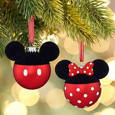 mickey and minnie mouse christmas ornaments hanging from a tree