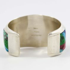 Sterling Silver Cuff Bracelet with Inlaid Jet, Spiny Oyster Shell, Phosphosiderite, Rhodochrosite, Turquoise, Coral, Lapis, Opal, and White Marble Depicting Yei Figures on a Night Sky Background. 1.5” Cuff Width 5” Inside Measurement, plus 1” opening (6" Total Circumference - Small) Luxury Turquoise Cuff Bracelet With Inlay, Artisan Multicolor Inlay Cuff Bracelet, Luxury Multicolor Inlay Cuff Bracelet, Luxury Southwestern Gemstone Cuff Bracelet, Sterling Silver Turquoise Cuff Bracelet With Inlay, Concho Belt, Zuni Jewelry, Navajo Jewelry, Native Jewelry