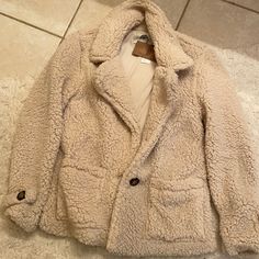 *****Brand New!!**** Sherpa Cozy Jacket. Color:Oatmeal (Light Beige). Never Worn. With Tags. Very Soft And Comfortable. Cozy Long Sleeve Neutral Outerwear, Cozy Neutral Long-sleeve Outerwear, Cozy Neutral Long Sleeve Outerwear, Cozy Beige Outerwear, Cozy Cream Outerwear With Pockets, Cozy Beige Sherpa Outerwear, Cream Sherpa Outerwear For Cold Weather, Sherpa Coat, Cozy Jacket