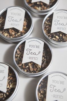 six tins filled with different types of tea in each one, labeled you're tea rich