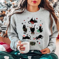 Christmas Black Cat Sweatshirt, Funny Meowy Christmas Hoodie, Christmas 2024 Outfit, Cat Mom Outfit, Holiday Cat Lover Hoodie, Xmas Gifts Here's a simplified guide on how to place an order: -Review all the photos provided. -Choose your Sweatshirt/Hoodie color from the selection boxes. -Choose your Sweatshirt/Hoodie size from the selection boxes. -If available, specify the personalization box in accordance with the requested items. -Indicate the quantity desired. -Add the selected items to your cart. -Proceed to complete the checkout process. SWEATSHIRT SPECIFICATIONS: -Made of 50% Cotton and 50% Polyester. -Features a 1x1 ribbed collar, cuffs, and waistband with spandex for durability and comfort. -Set-in sleeves for enhanced comfort. -Sized as UNISEX, not tailored for Women's sizes. -Swea Hippo Christmas, Holiday Sweaters, Cat Themed Gifts, Cat Holidays, Meowy Christmas, Cat Hoodie, Cat Sweatshirt, Christmas Hoodies, Hippopotamus