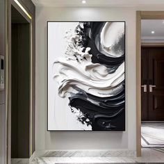 an abstract painting hangs on the wall in a modern room with marble floors and walls