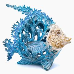 a blue and white fish statue sitting on top of a table