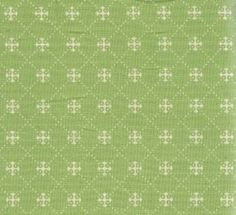 a green and white fabric with small crosses pattern on it, as well as the background