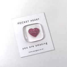 a card with a heart in the middle