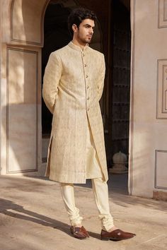 Beige champagne sherwani with badla embroidery. Comes with churidar and a kurta. - Aza Fashions Elegant Designer Wear Beige Sherwani, Elegant Designer Beige Sherwani, Formal Beige Raw Silk Kurta, Formal Straight Kurta Sherwani In Raw Silk, Cream Kurta For Formal Diwali Occasion, Formal Cream Kurta For Diwali, Formal Cream Kurta For Diwali Festival, Formal Beige Sherwani For Transitional Season, Formal Cream Sherwani With Straight Kurta