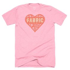 a pink t - shirt with the word fabric printed on it's chest and heart