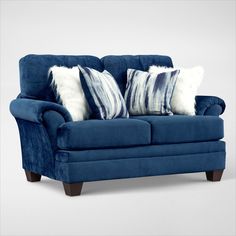 a blue couch with two pillows on it