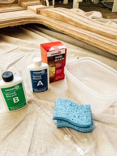 some cleaning supplies are laying out on a table