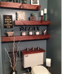 a bathroom with shelves above the toilet