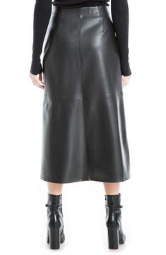 Rich faux leather is structed with soft seams to created a pieced-toghether look that flatters any figure. 33.25" length Elastic waistband Shell: 100% polyurethane, backing: 100% polyester Hand wash, line dry Imported Model stats: 5'10" height, 32" bust, 25" waist, 36" hip. Classic Leather Skirt For Fall, Sleek Knee-length Leather Skirt, Modern Leather Pencil Skirt, Leather Knee-length Lined Skirt, Leather Lined Skirt For Winter, Sleek Leather Bottoms In Solid Color, Winter Leather Midi Skirt, Sleek Leather Skirt For Spring, Sleek Leather Bottoms