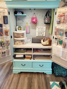 an organized craft room with lots of storage