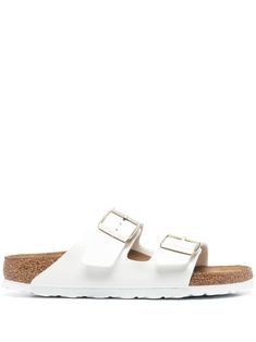 Arizona double-strap slides from BIRKENSTOCK featuring logo print to the side, open toe, buckle-strap fastening, branded insole, rubber outsole and white. White Synthetic Footbed Sandals With Buckle Closure, White Synthetic Double Strap Footbed Sandals, White Double Strap Footbed Sandals, White Synthetic Footbed Sandals, Classic White Footbed Sandals For Spring, White Leather Sandals With Cushioned Footbed, White Double Strap Footbed Sandals With Removable Insole, White Double Strap Sandals With Cork-bed Midsoles, White Leather Footbed Sandals With Double Strap