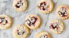 raspberry cream cheese crescent danish pastries on a marble surface with the words, raspberry cream cheese crescent danish