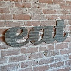 a brick wall with the word ouu painted on it