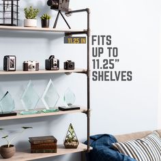 the shelves are filled with trophies and other items for sale on display in front of a white wall