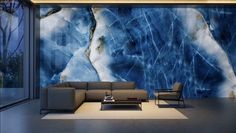 a modern living room with blue marble wallpaper