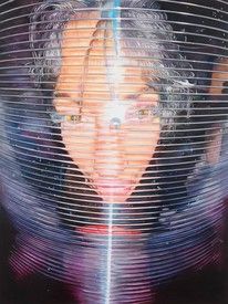 a woman's face is reflected in a wire mesh covering her head and neck