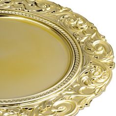 a gold plate with ornate designs on the rim and sides, isolated against a white background