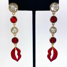 Rhinestone Red Laser Cut Pearl Acrylic Lip Dangle Earrings. Each earring consents of four bezel-set rhinestones and a red pearl laser cut lip charm. The red lip charm is 3mm thick and 0.92" x 0.54". Gold plated jump rings, gold tone clutch backing with clear plastic surround. The earrings measure 0.56" wide x 3.15" long. The earrings are from another pair of earrings and I cut and added the acrylic lip charms. *The bezels, rhinestones and posts are new, they were part of another pair of earrings that I disassembled then I added the lip charms. Red Pearl, Rings Gold, Red Lip, Etsy Earrings Dangle, Red Lips, Clear Plastic, Jump Rings, Bezel Setting, Laser Cut