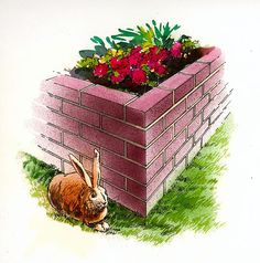 a rabbit sitting in the grass next to a brick planter with flowers growing out of it