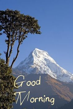 the words good morning are written in front of a mountain with trees and snow on it