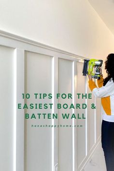 a woman is using a driller on the wall with text that reads 10 tips for the easier board & batten wall